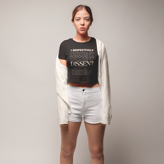 Model wearing I Dissent organic rib baby tee with a stylish outfit, promoting a bold statement in fashion.