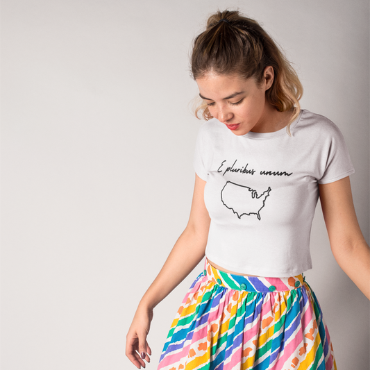 E Pluribus Unum Latin motto shirt on a model, highlighting unity and resistance in organic cotton.
