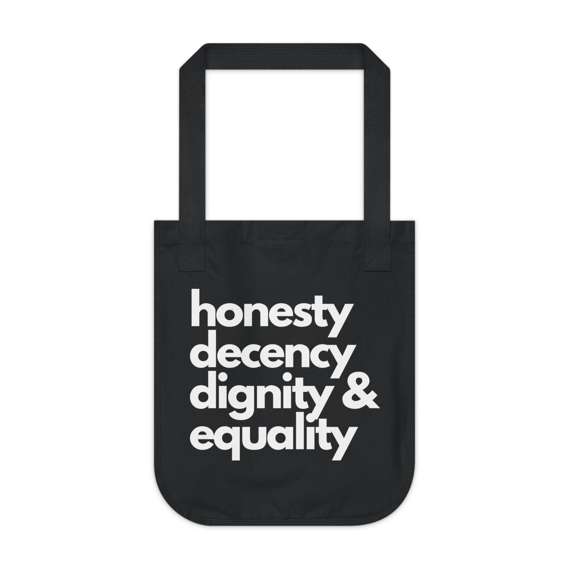 Black tote bag with white text 'honesty decency dignity & equality' on a white background